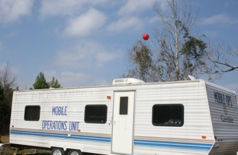 Communication Trailer and Balloon in background.