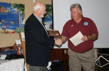 Terry AE5RI presents Bob K4UEE with K5GDX Life Membership Award.