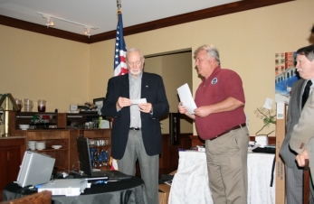 Terry AE5RI presents Bob K4UE with a donation from the K5GDX for his K1N Navassa Island Dxpedition