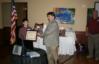 Dave K5UZ presents KF5NYQ with his ARRL DXCC certificte at 11 year old.